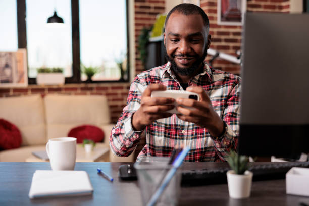 istock Young adult playing video games 1420726637