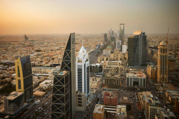 Al-Olaya, north of Riyadh, in late afternoon High angle view of modern architecture and local landmarks in central business, financial, and residential districts with sun setting over horizon. riyadh stock pictures, royalty-free photos & images