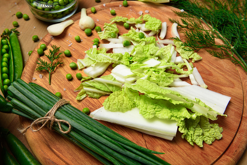 Fresh various vegetables on a wooden table background, with a space for headline copy