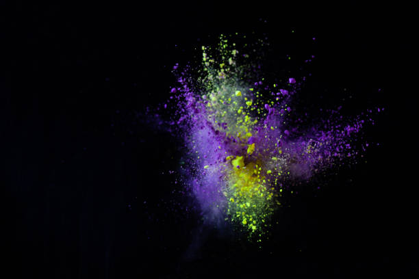 colorful powder explode on black background captured in high speed stock photo