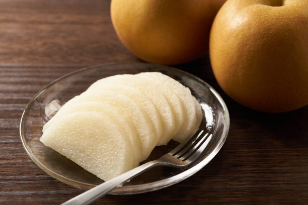 istock Japanese pear on wooden background 1420730229
