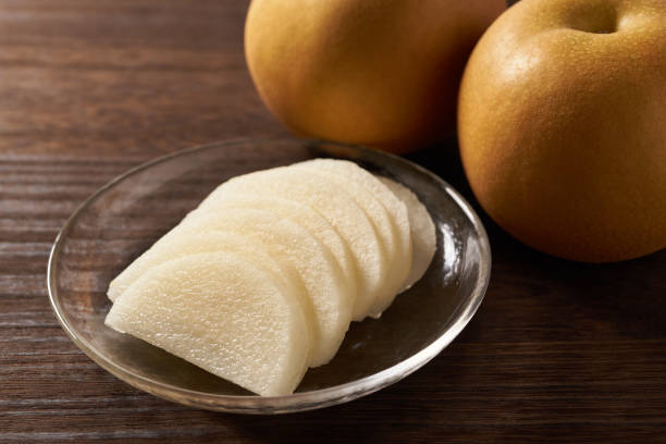 istock Japanese pear on wooden background 1420730507