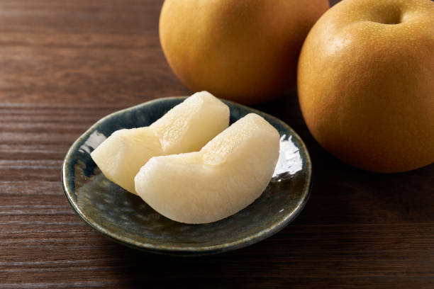istock Japanese pear on wooden background 1420730727