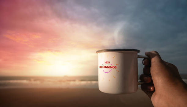 istock Start a New Day. New Beginning Concept. Drinking Hot Coffee by the Beach during Sunrise. Hand Holding a Cup to Enjoying Favorite Drink and Nature. Harmony Living Lifestyle. POV View 1420733103