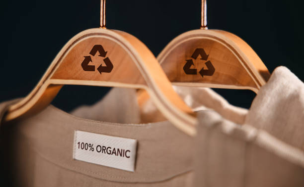 istock Recycling Products Concept. Organic Cotton Recycling Cloth. Zero Waste Materials. Environment Care, Reuse, Renewable for Sustainable Lifestyle. Recycle Icon show on Clothes Hanger 1420733984