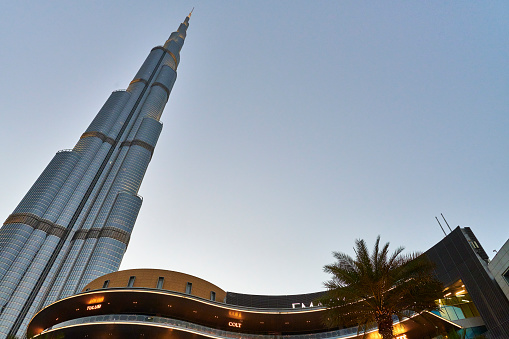 Dubai, United Arab Emirates - May 30, 2022: the skyscraper Burj Khalifa seen from The Dubai Mall at sunset.