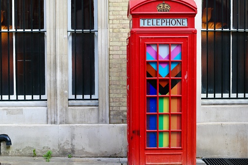 London,U,K-July 2022: Telephone boxes in rainbow colours for pride month