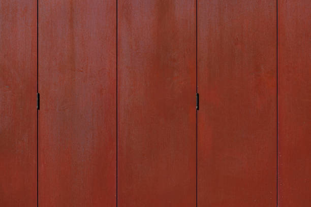 Rust colored wall that can fold away.