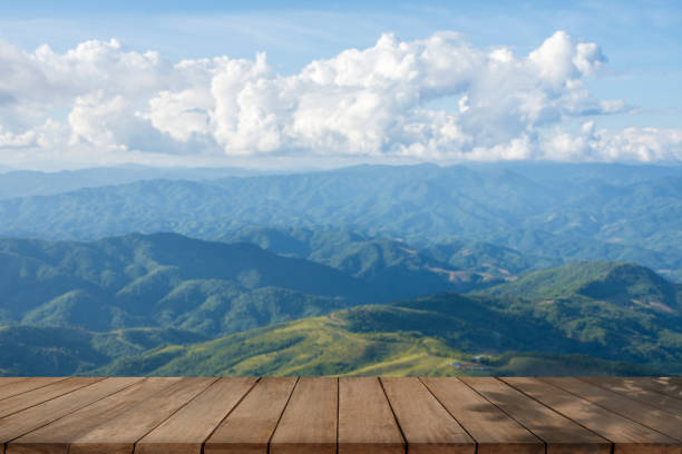 istock wooden table and beauty blur sky and mountains as background 1420738113