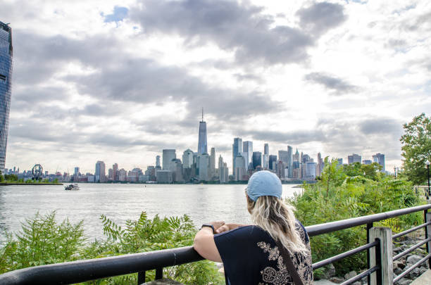 istock Woman looking at New York City 1420739934