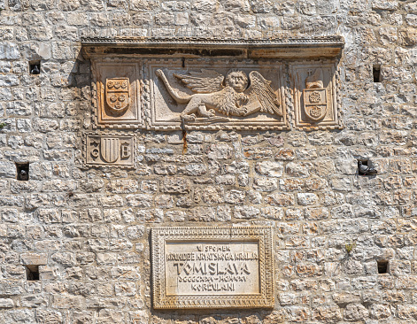 Tower Revelin, dating from 13th century. Relief plaque of windged lion of Venice (lion of St Mark) as well as a plaque with following text: In memory of the coronation of Croatian King Tomislav.