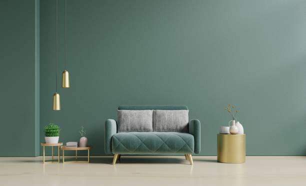 istock Modern minimalist interior with a green sofa on empty dark green wall. 1420744422