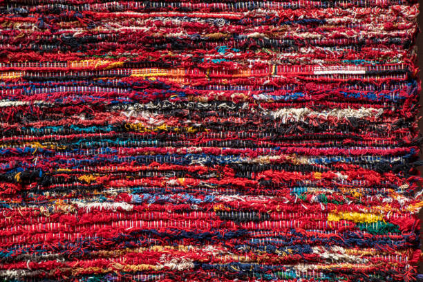 istock close up of a colourful red striped rug 1420746904