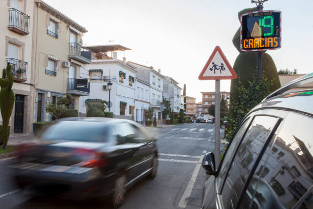 istock Vehicule crossing close to radar speed sign pole 1420747425