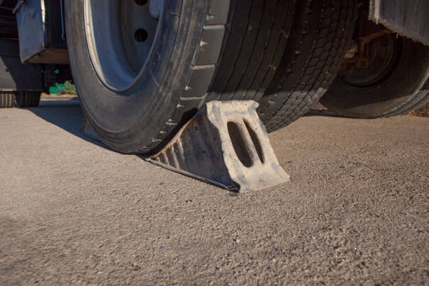 istock Metal wheel chock under trailer. 1420747442