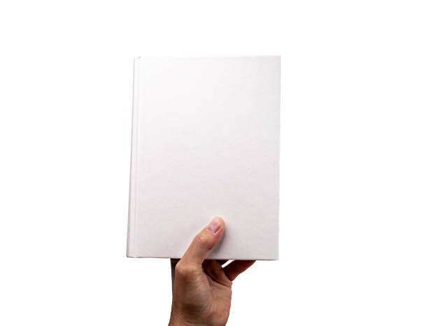 istock Hand holding hardback book mockup isolated on white background. Education, wisdom concept. Novel, encyclopedia, code, Bible, cookbook, guide template with blank cover. 1420750825