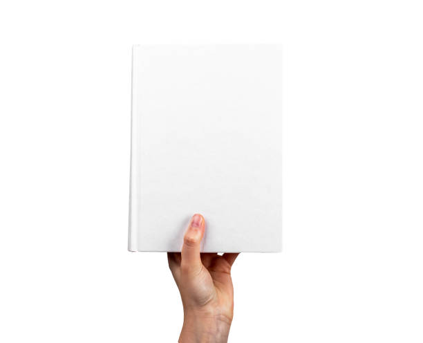 istock Hand holding closed book mockup isolated on white background. Novel, encyclopedia, code, Bible template with blank cover. Reading leisure, study, learning concept 1420750827