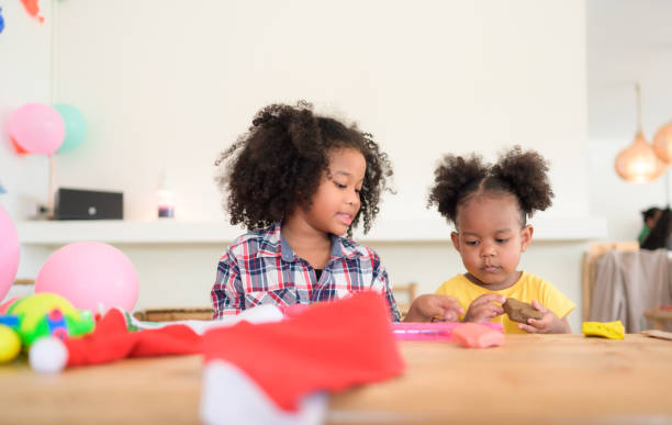 istock Two little girls Playing with plasticine 1420751426