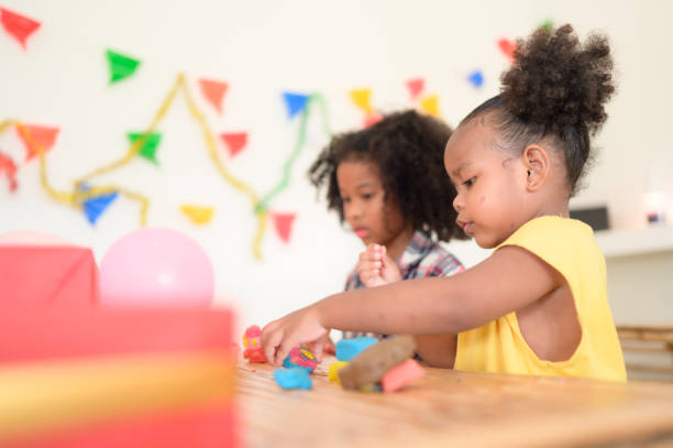 istock Two little girls Playing with plasticine 1420751442