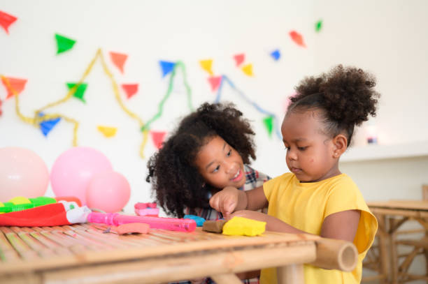 istock Two little girls Playing with plasticine 1420751443
