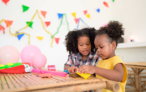 istock Two little girls Playing with plasticine 1420751445