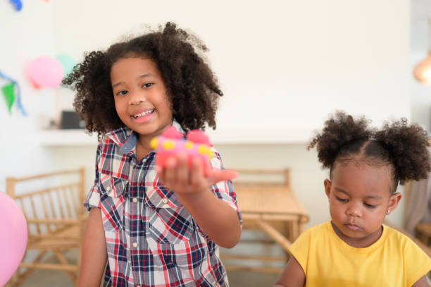 istock Two little girls Playing with plasticine 1420751448