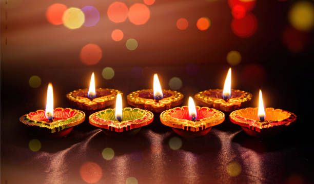 istock Diwali, Deepavali Hindu festival. Diya lamp lit on bokeh lights 1420753473