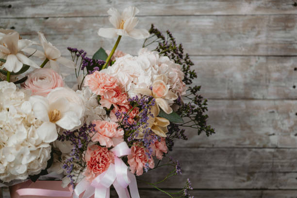 istock Beautiful flowers composition on wooden background 1420755461