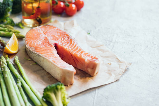 istock Fresh salmon steak and vegetables 1420755512