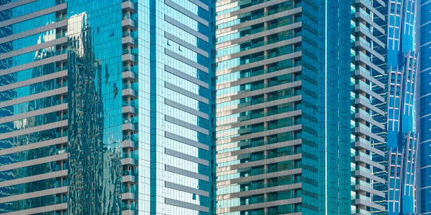 istock Glass facade of modern office building in Dubai 1420757245
