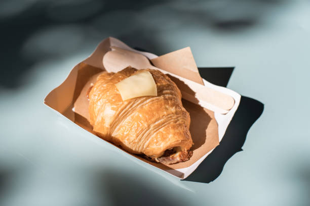 istock Fresh croissant served in white paper plate 1420757840