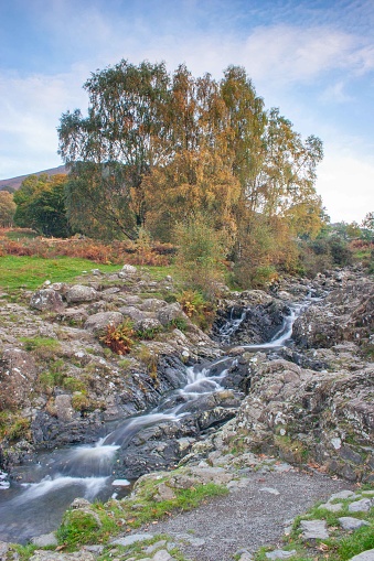 Barrow Beck tumbles over the rocks on an autumn day in Cumbria, English Lake District.