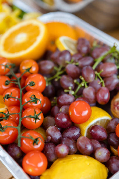 istock Small tomatoes, pomegranates, oranges, grapes, healthy life 1420760224