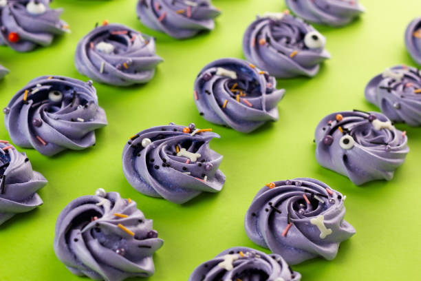 istock Meringue Halloween - top view, on light green background. 1420760381