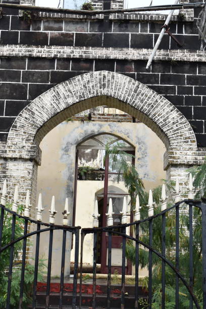 Former House of Parliament in St. George's, Grenada St. George's, Grenada - August 23, 2022 - One of the gate entrances to the Former House of Parliament or York House on Church Street. This building was built using Georgian inspired architecture in the 1780s. However, it was destroyed by Hurricane Ivan in 2004. hurricane ivan stock pictures, royalty-free photos & images