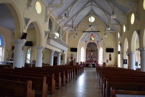 The Interior Design of the Cathedral of the Immaculate Conception, St. George's, Grenada St. George's, Grenada - August 23, 2022 - Inside of the Cathedral of the Immaculate Conception, a Roman Catholic Church on Church Street in St. George's, the Capital City of Grenada. The construction of the church was completed in 1884 and is a reflection of Grenada's colonial history with Europe. Due to damages caused by Hurricane Ivan in 2004, parts of the church had to be rebuilt hurricane ivan stock pictures, royalty-free photos & images