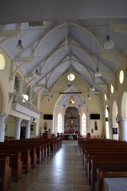 The Interior Design of the Cathedral of the Immaculate Conception, St. George's, Grenada St. George's, Grenada - August 23, 2022 - Inside of the Cathedral of the Immaculate Conception, a Roman Catholic Church on Church Street in St. George's, the Capital City of Grenada. The construction of the church was completed in 1884 and is a reflection of Grenada's colonial history with Europe. Due to damages caused by Hurricane Ivan in 2004, parts of the church had to be rebuilt hurricane ivan stock pictures, royalty-free photos & images