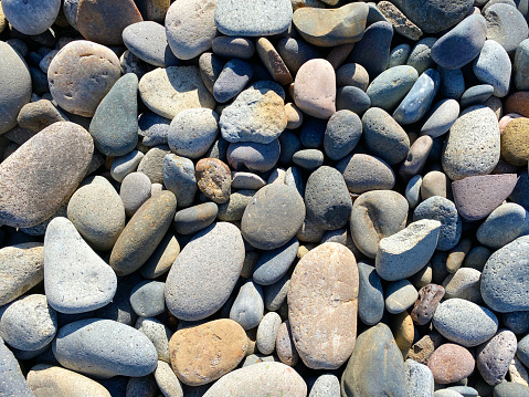 a sea ocean rocks smooth pebble beach pebbles rock heap garden yard path walkway