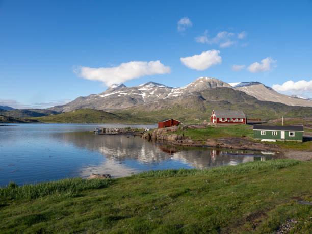 View of Igaliku in southern Greenland. A settlement with just a few dozen inhabitants. Famous for its Norse ruins of GarÃ°ar and its unique farming sites at the edge of the ice cap. stock photo
