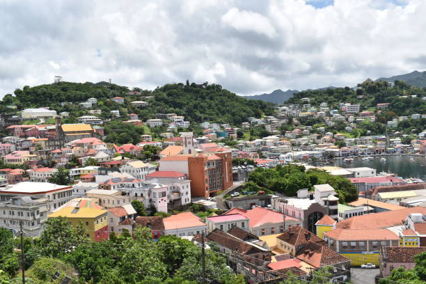 St. George's, Grenada St. George's, Grenada - August 23, 2022 - Commercial buildings, historical landmarks and residential buildings in St. George's, the capital city of Grenada hurricane ivan stock pictures, royalty-free photos & images