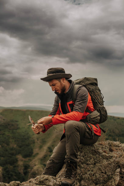 istock mountaineer young man climbing in mountains 1420764987