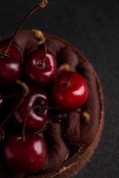 istock Chocolate tart with ganache decorated with fresh cherry 1420770278
