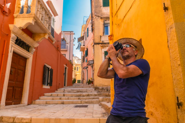 A tourist taking a photo in Corfu. Greece