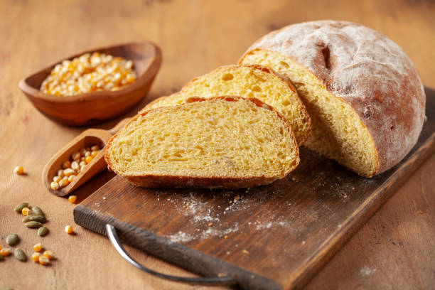 istock Fresh cornbread and corn grains on the table. Food grain crisis concept 1420772191