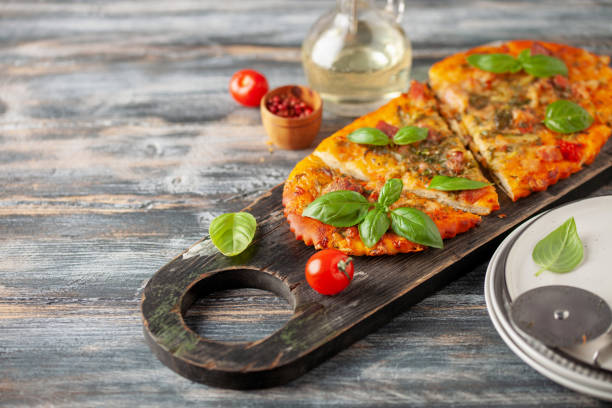 istock Homemade pizza with tomatoes, mozzarella and basil. 1420772199