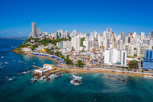 Aerial view of the beach with the city in the background.