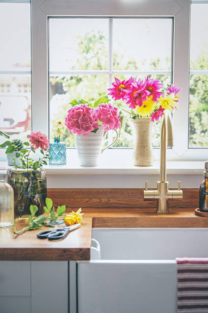 istock Arranging cut flowers from late summer in the kitchen 1420776092