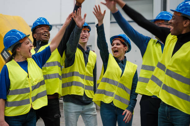 istock Group of factory workers celebrating good times together 1420776621