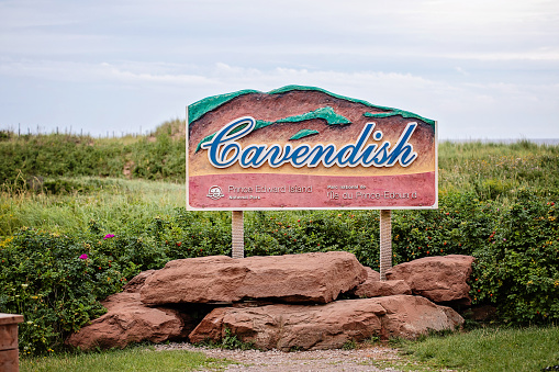 Cavendish, Canada - August 23, 2022.  A sign for Cavendish Beach National Park on Prince Edward Island, a park which hosts a trail, a sandy beach, and dunes in between.