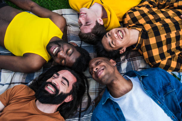 istock Group of young people lying down aerial view 1420778349